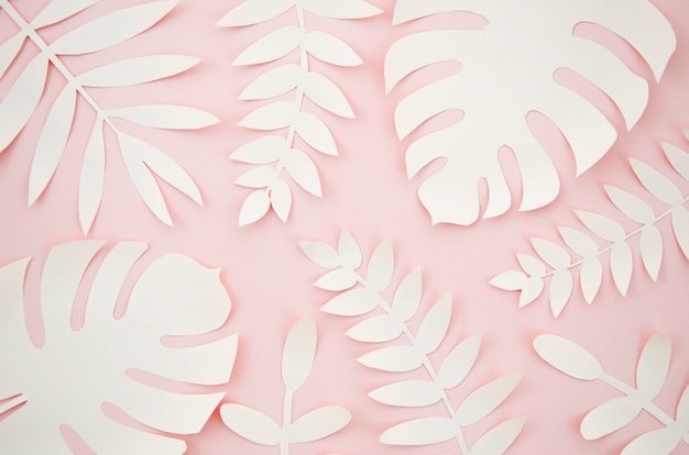 Artificial leaves paper cut style with pink background