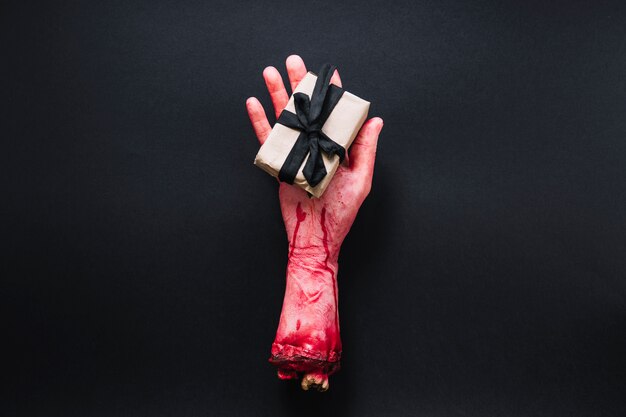 Artificial severed hand with packed present