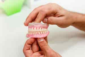 Free photo artificial teeth of full mouth in the dental office