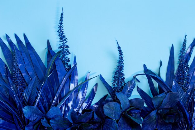 artificial tropical beautiful blue flowers and leaves.