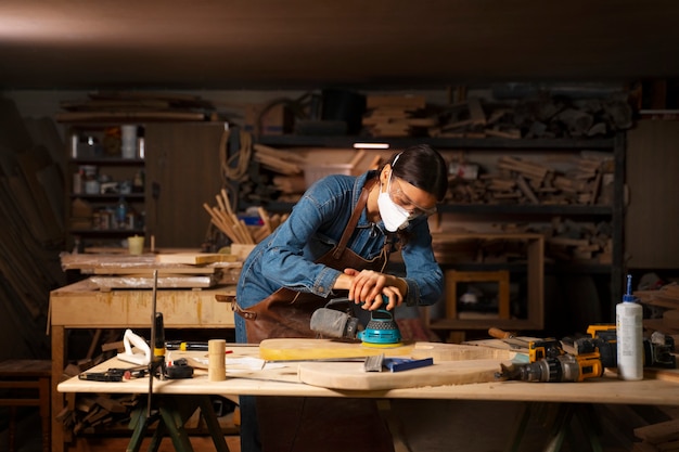 Artisan doing woodcutting medium shot