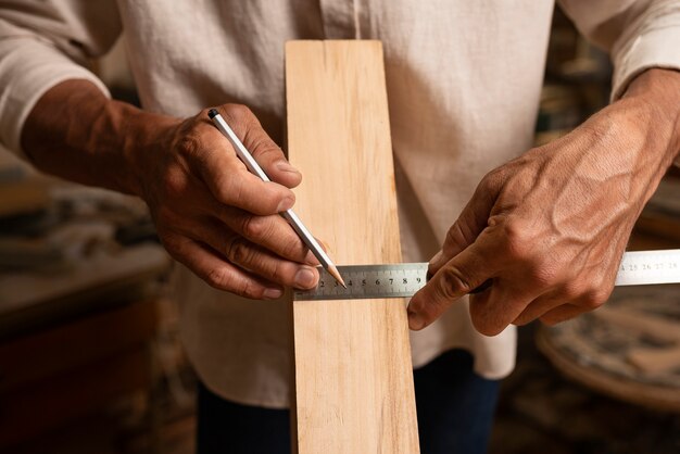 Free photo artisan doing woodcutting