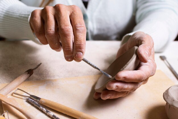 Artisan making pot