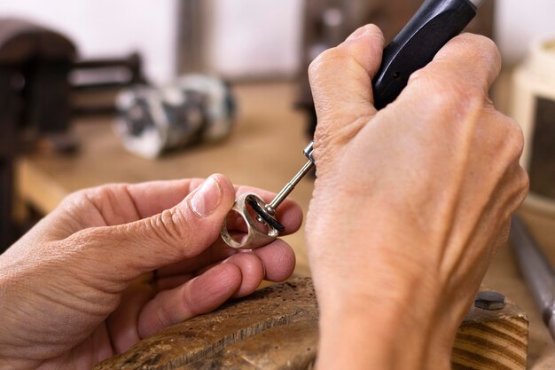 Artisan polishing ring close-up