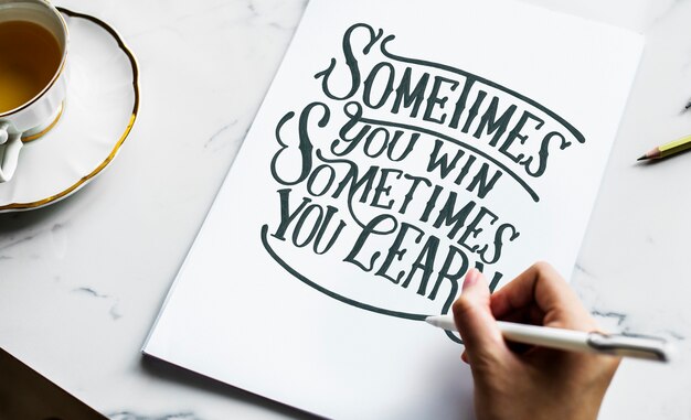 An artist creating hand lettering artwork