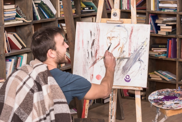 Artist painting in studio