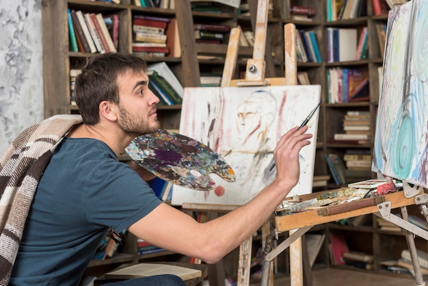 Artist painting in studio