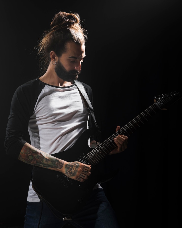 Free Photo artist playing guitar on stage