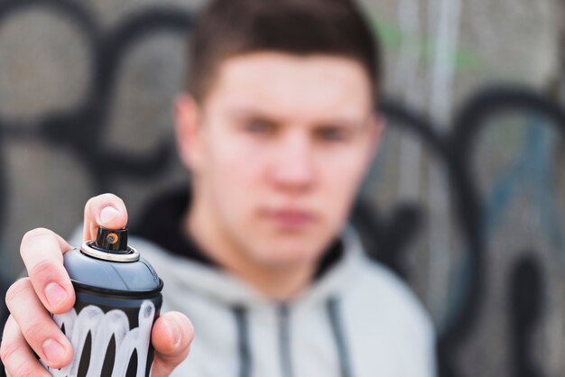 Artist using aerosol spray bottle