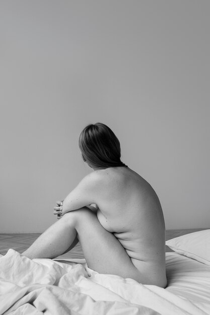 Artistic nude woman posing