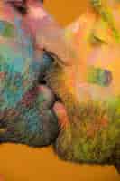 Free photo artistic painted homosexual men kissing passionately