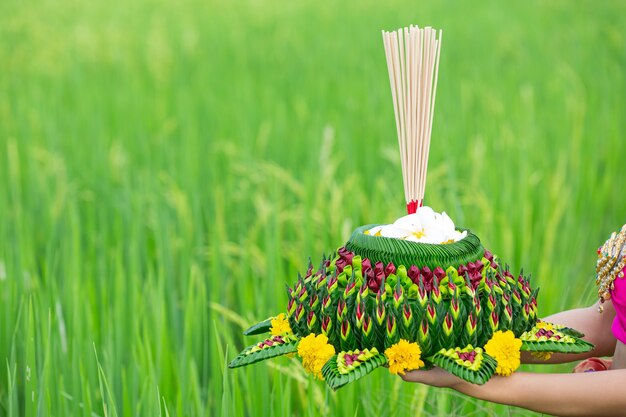 Asia woman in Thai dress traditional hold kratong. Loy krathong festival