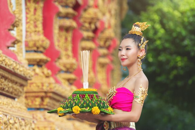 Asia woman in Thai dress traditional hold kratong. Loy krathong festival