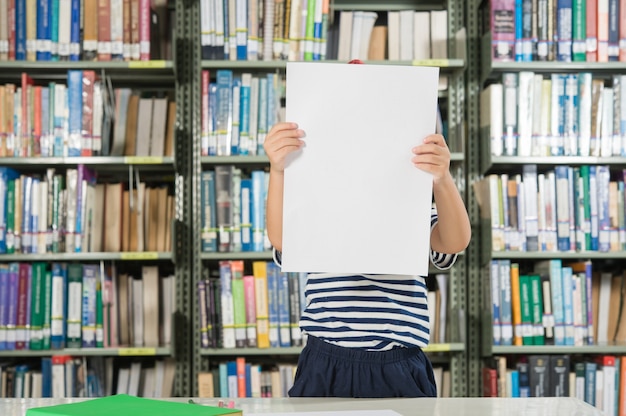 Asian boy in library room school