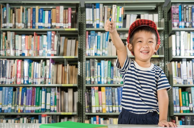 Asian Boy in library room school