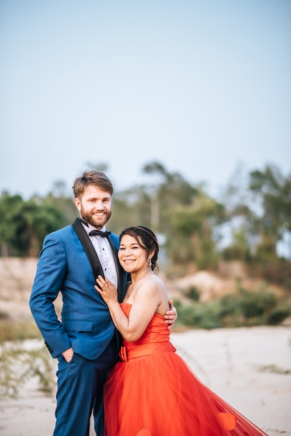 Asian bride and Caucasian groom have romance time and happy together 