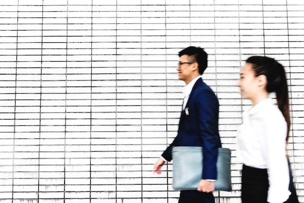 Asian business people walking