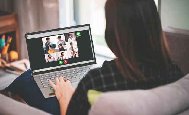 Asian business woman meeting with multiethnic business people and video conference live streaming in work from home concept
