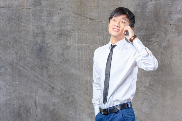 Asian businessman talking on mobile cell phone