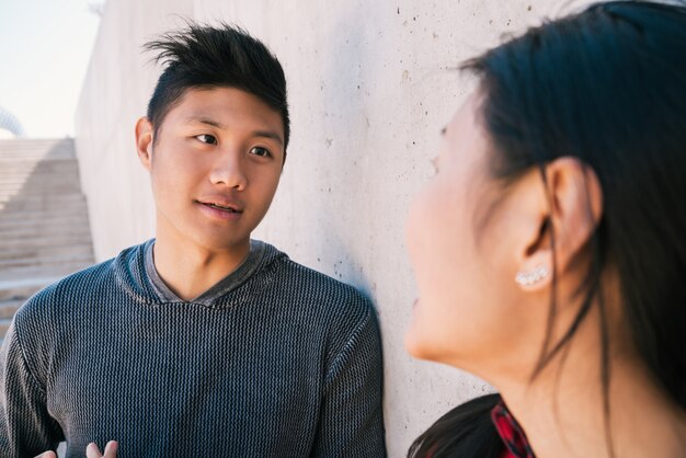 Asian couple having a conversation.