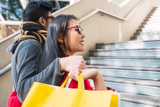 Asian couple shopping in the mall.