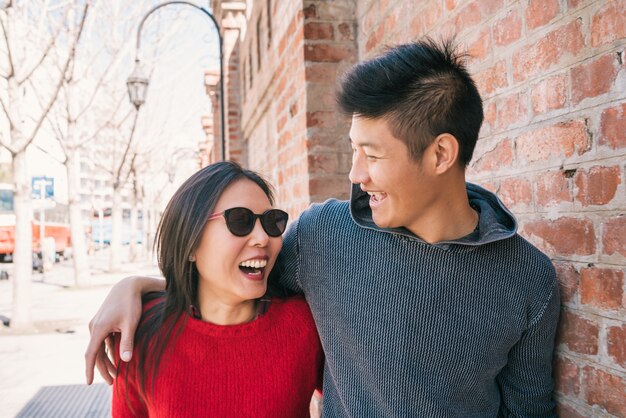 asian couple walking in the city.