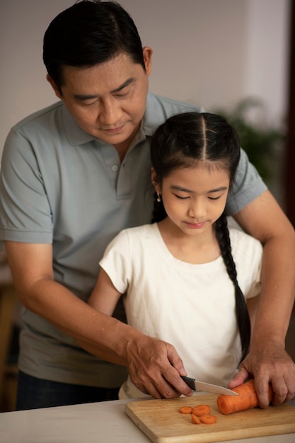 Asian family cooking together