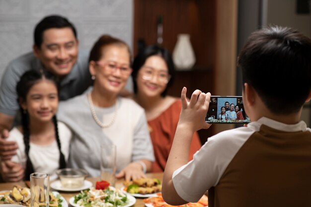 Asian family eating together