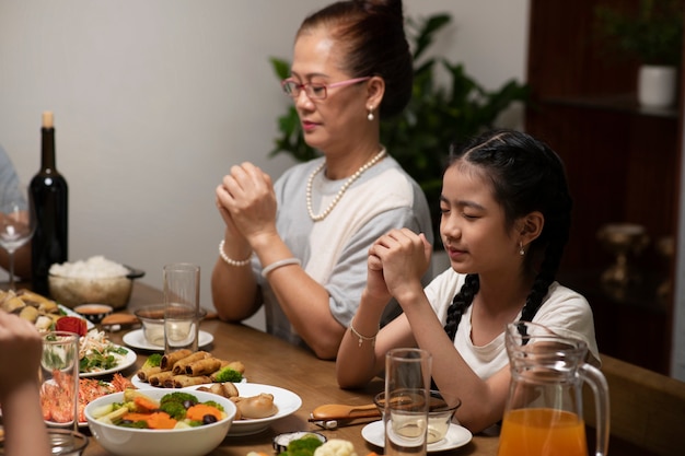 Asian family eating together