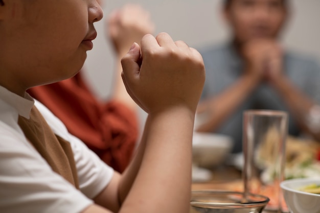 Free photo asian family eating together