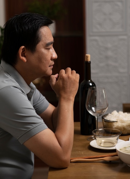 Free photo asian family eating together