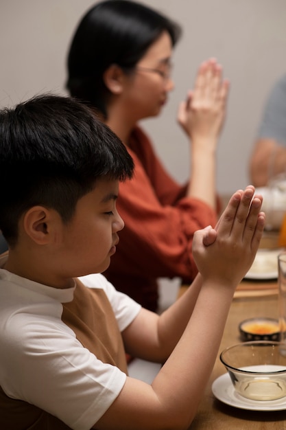 Asian family eating together