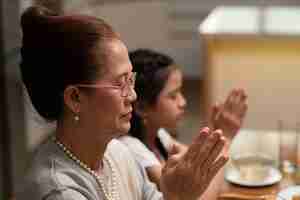 Free photo asian family eating together