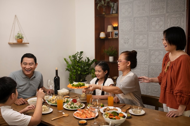 Asian family eating together