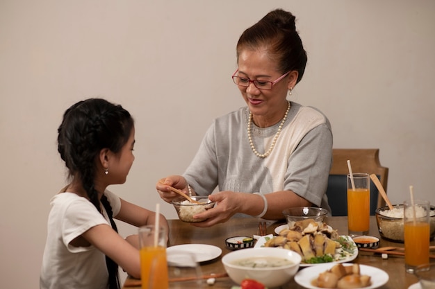 Asian family eating together