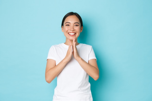 Asian female in casual T-shirt posing