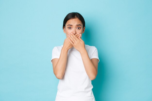 Asian female in casual T-shirt posing