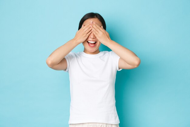 Asian female in casual T-shirt posing