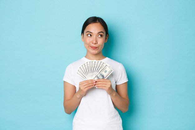 Asian female in casual T-shirt posing