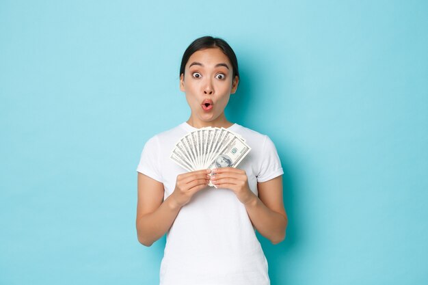 Asian female in casual T-shirt posing