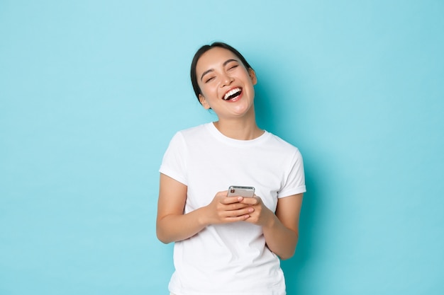 Asian female in casual T-shirt posing