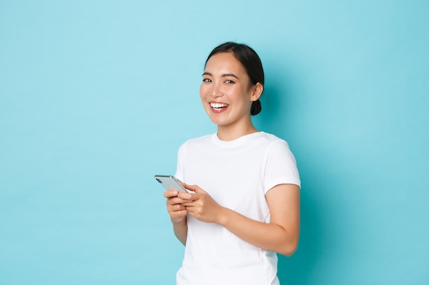 Asian female in casual T-shirt posing