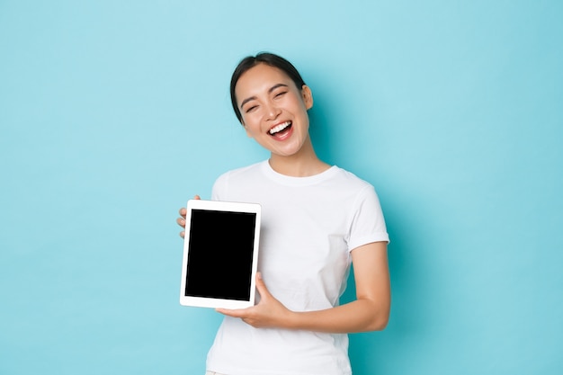 Asian female in casual T-shirt posing