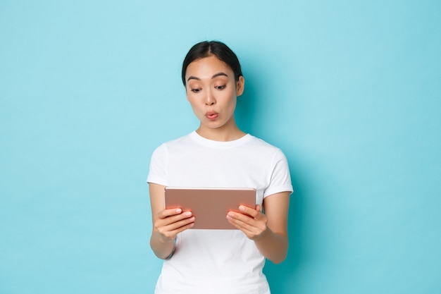 Asian female in casual T-shirt posing