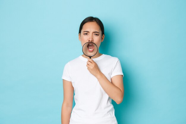 Asian female in casual T-shirt posing