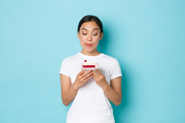 Asian female in casual T-shirt posing