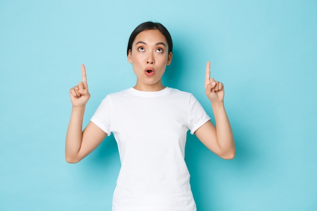 Asian female in casual T-shirt posing