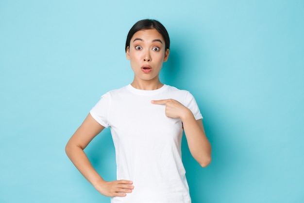 Asian female in casual T-shirt posing