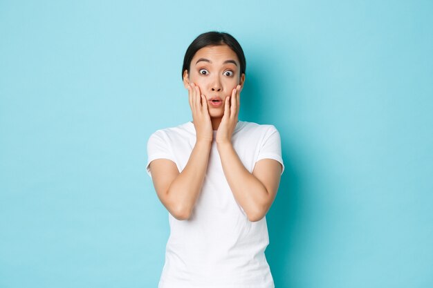 Asian female in casual T-shirt posing