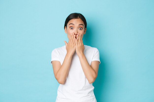 Asian female in casual T-shirt posing